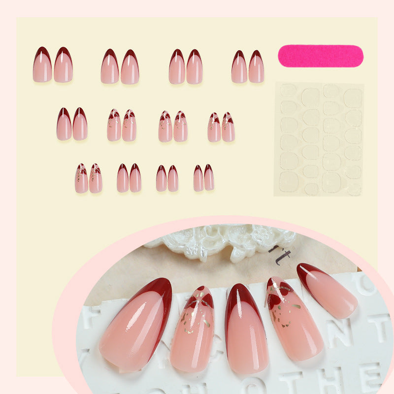 Elegant Stiletto Press-On Nail Set with Decorative Gold Accents Bowlift