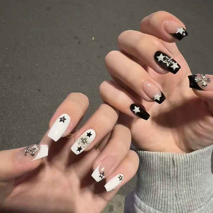Artful nail art with star motifs and glitter accents Bowlift