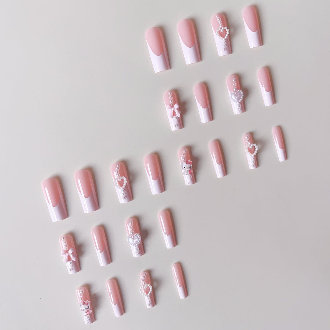 Artificial nail set with playful 3D care and pearl decorations Bowlift