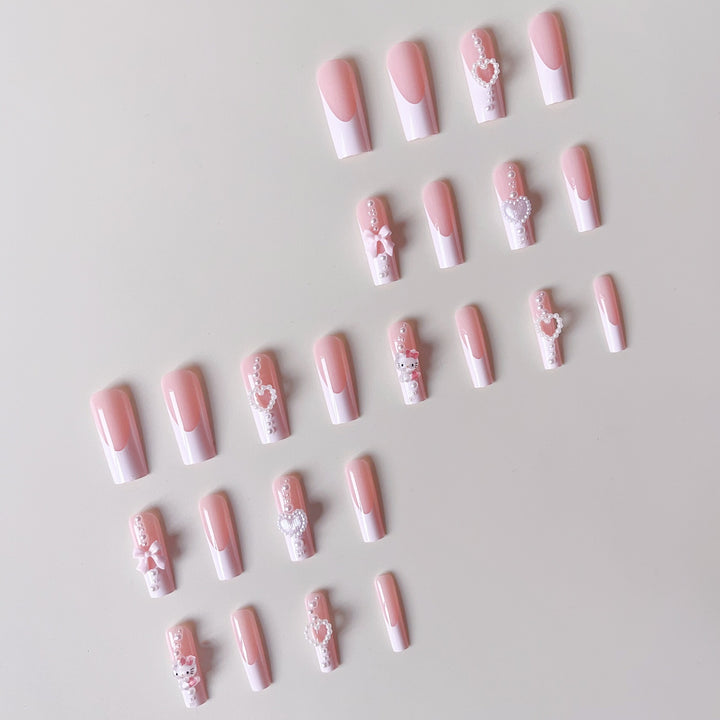 Artificial nail set with playful 3D care and pearl decorations Bowlift