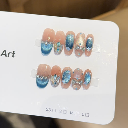 Artificial nail tips with glitter and watercolor effect Bowlift
