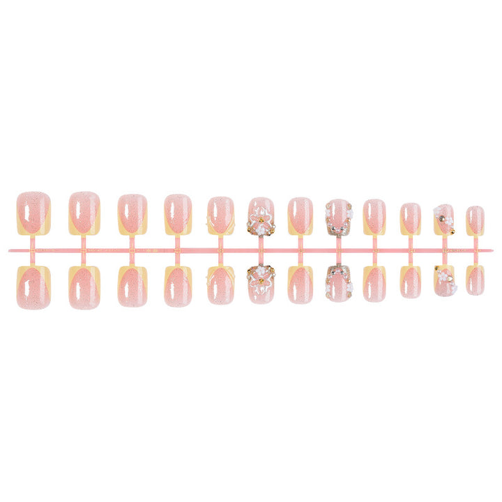 Nail art set with glamorous glitter and flower accents Bowlift