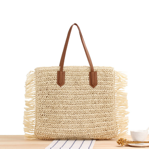 Beach bag with fringed design made of natural woven material Bowlift