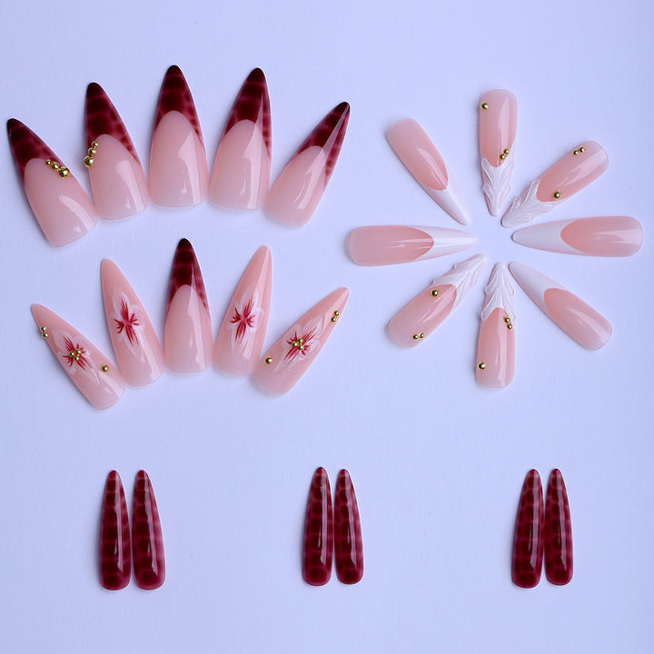 Artificial Nails in Elegant Modern Stiletto Style with Floral Design and Golden Accents Bowlift