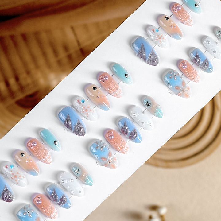 Creative nail art set with delicate floral and maritime designs Bowlift