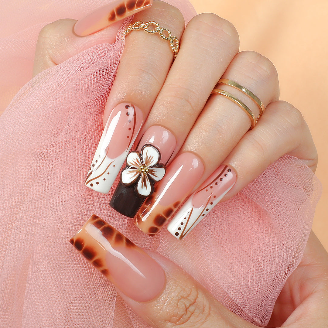 Creative nail art set with delicate floral and glitter accents Bowlift