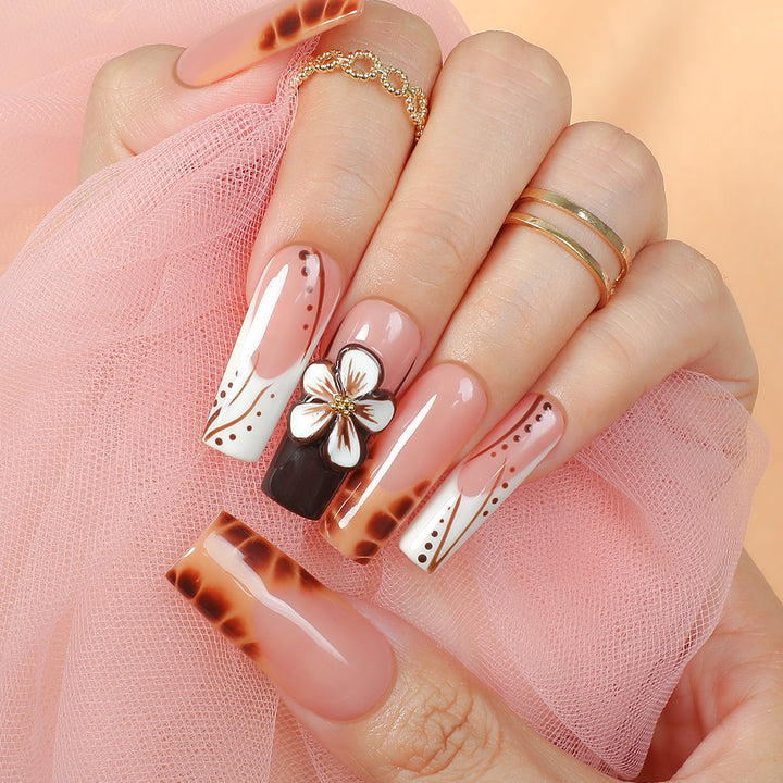Creative nail art set with delicate floral and glitter accents Bowlift