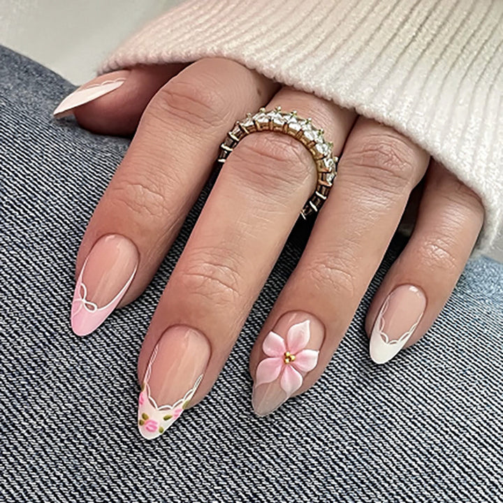 Artful nail extensions with delicate floral pattern and elegant accents Bowlift