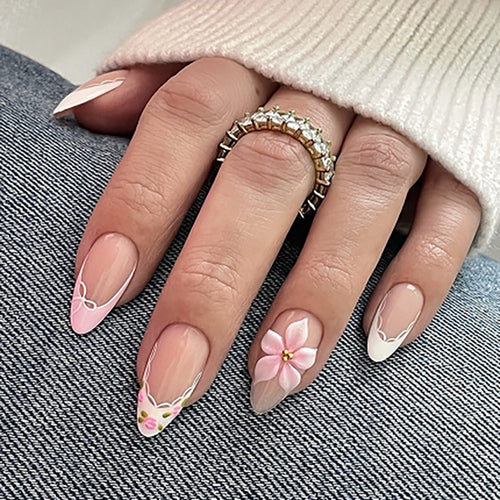 Artful nail extensions with delicate floral pattern and elegant accents Bowlift