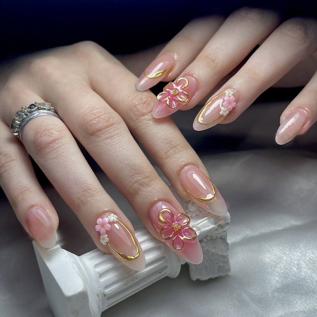 Acrylic nail set with elegant flower and gold decorations Bowlift