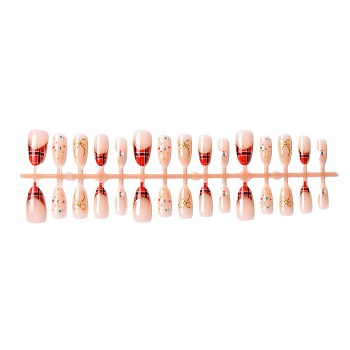 Artificial nail set with festive design and sparkling accents Bowlift