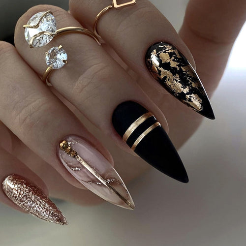 Glamorous stiletto nails with golden accents Bowlift