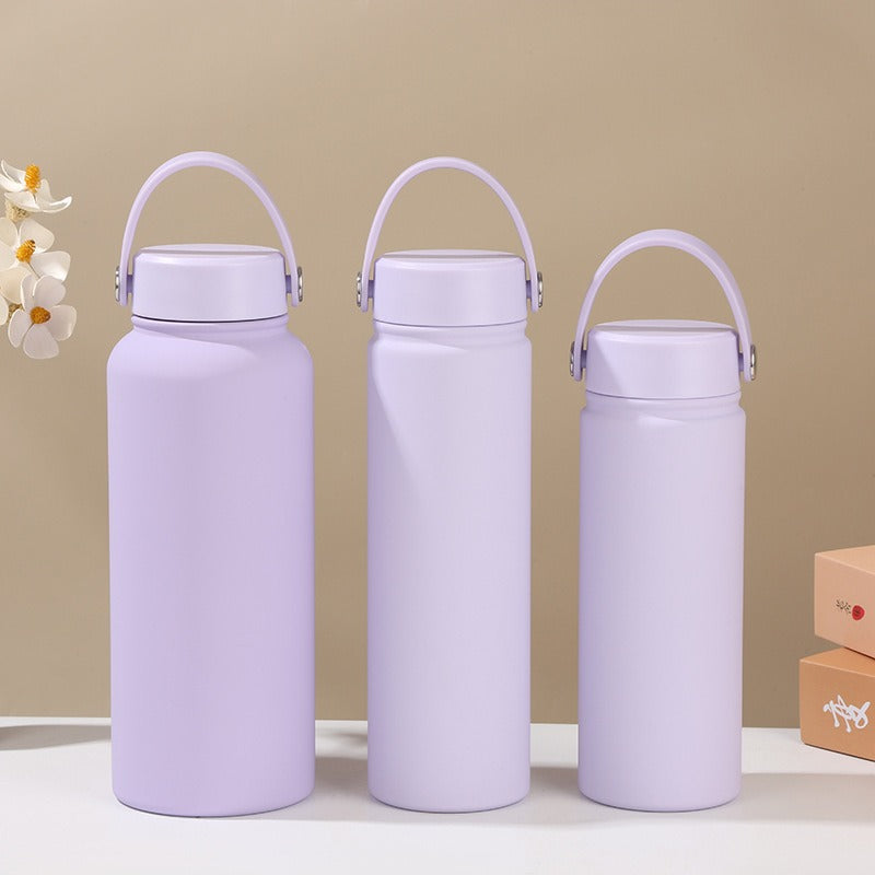 Women's double-walled insulated water bottle with practical carrying handle Bowlift