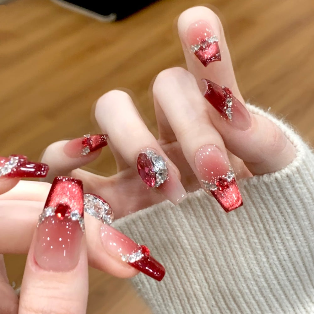Glamorous artificial nails with sparkling rhinestone applications Bowlift