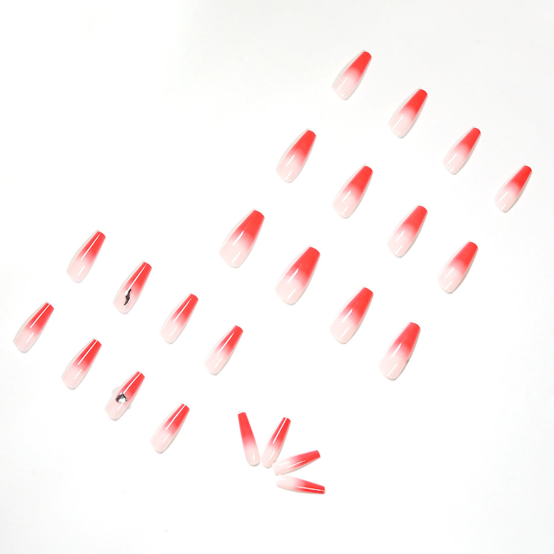 Artful stiletto nails with elegant gradient and rhinestone embellishment Bowlift