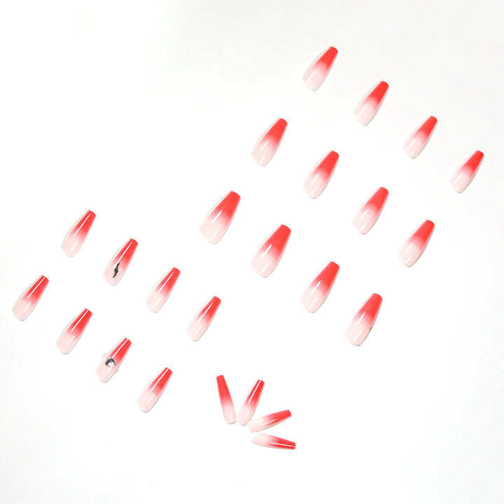 Artful stiletto nails with elegant gradient and rhinestone embellishment Bowlift