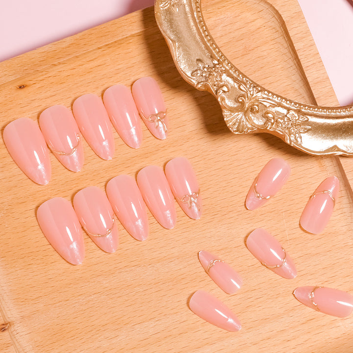 Artistic Pointed Press-On Nails with Gold Accents Bowlift