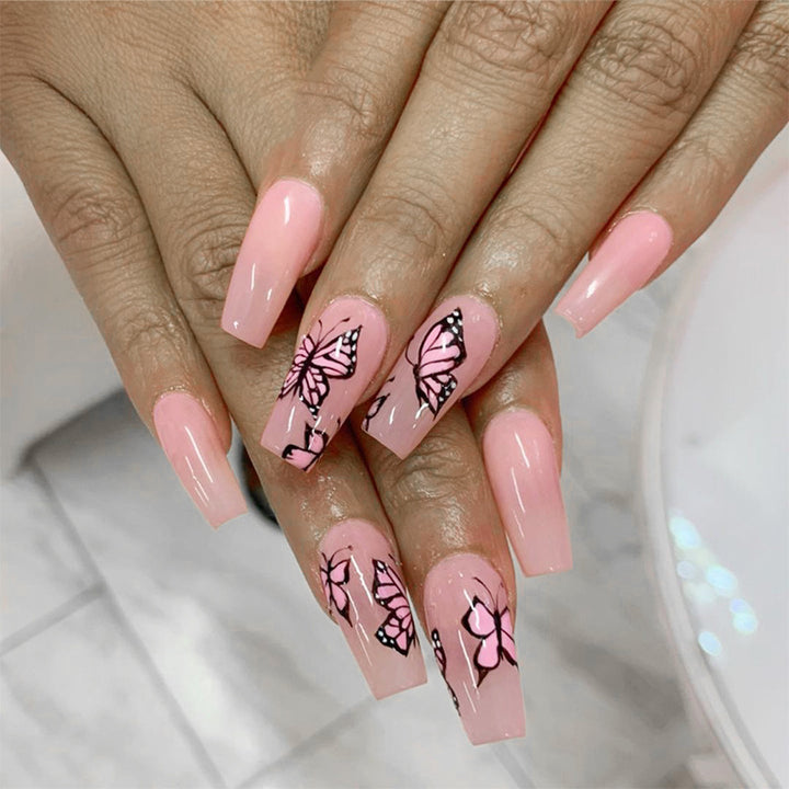 Artful acrylic nails with dynamic butterfly design Bowlift