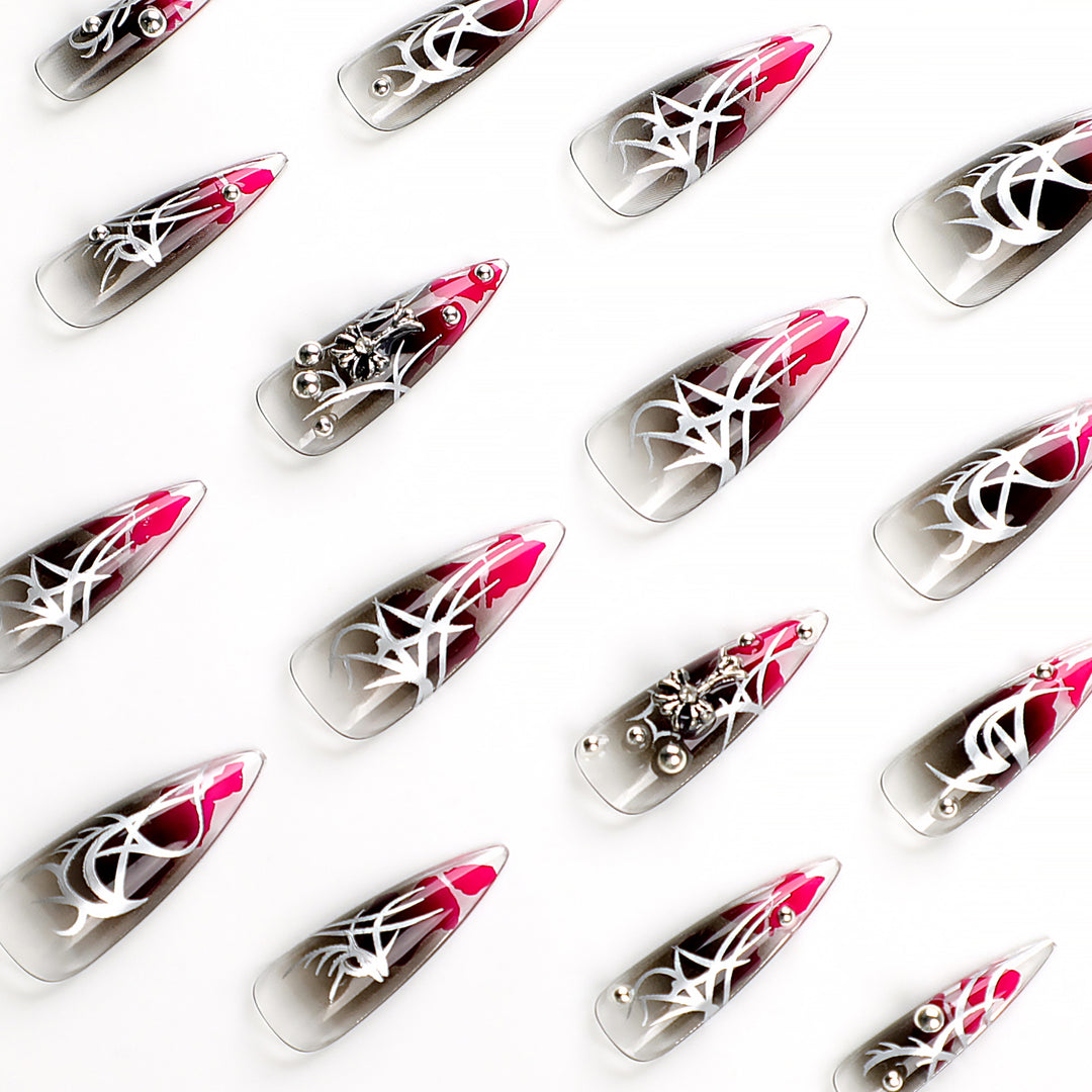 Artful stiletto nails with elegant decoration and modern accents Bowlift
