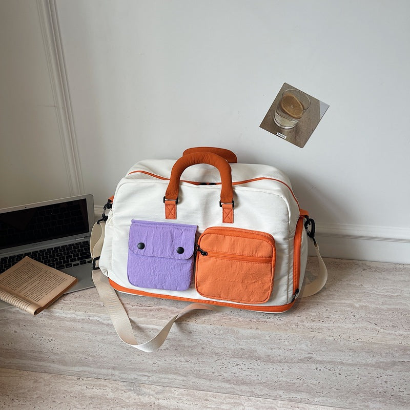 Sporty travel bag with multifunctional outer pockets Bowlift