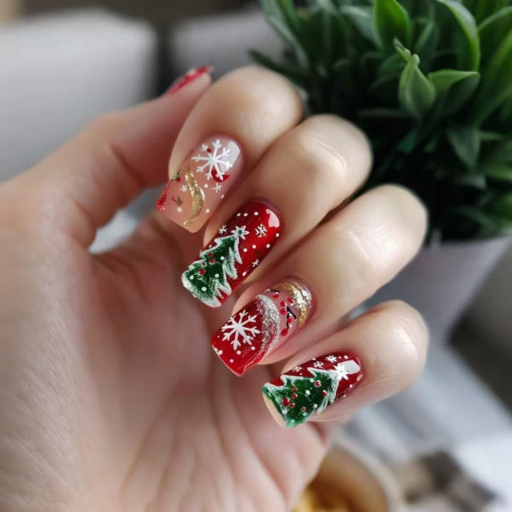 Artificial nail set with festive Christmas designs and glitter accents Bowlift