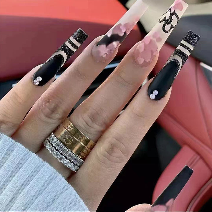 Artificial nail set with creative 3D elements and sparkling accents Bowlift