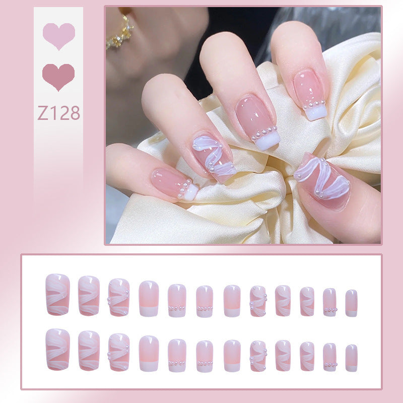 Nail art set with elegant wave patterns and delicate pearl accents Bowlift