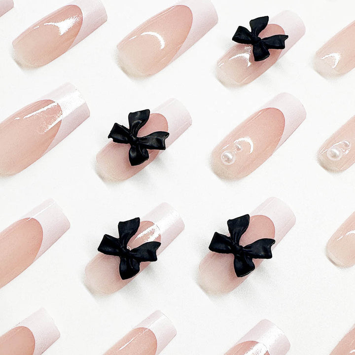 Acrylic nail set with stylish black and pearl details Bowlift