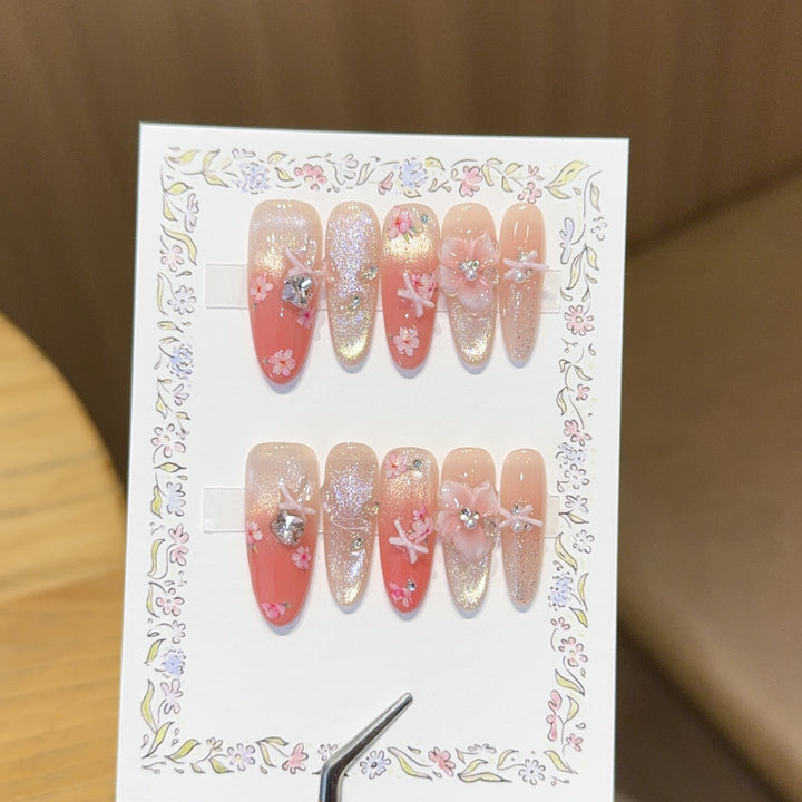 Artificial nails with floral embellishments and glitter effects Bowlift