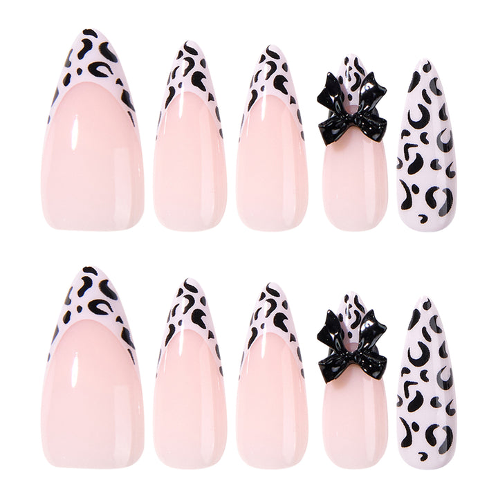 Artful Stiletto Nails with Leopard Print and Bow Accent Bowlift