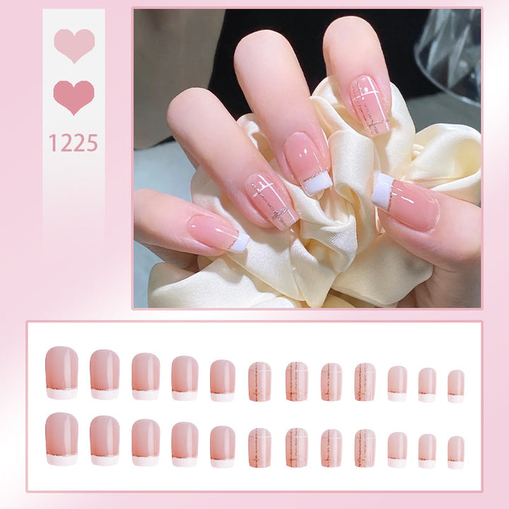 Nail set with elegant French tip and fashionable embellishments Bowlift