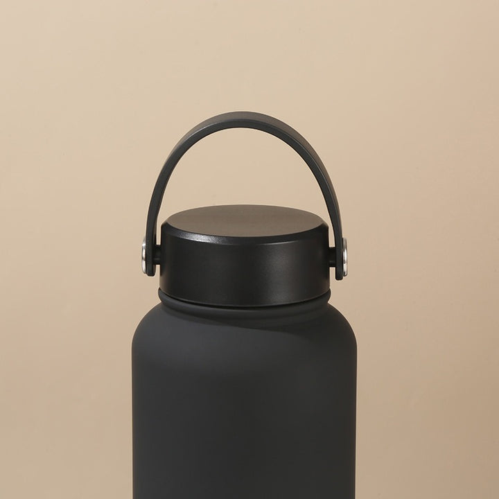 Women's double-walled insulated water bottle with practical carrying handle Bowlift