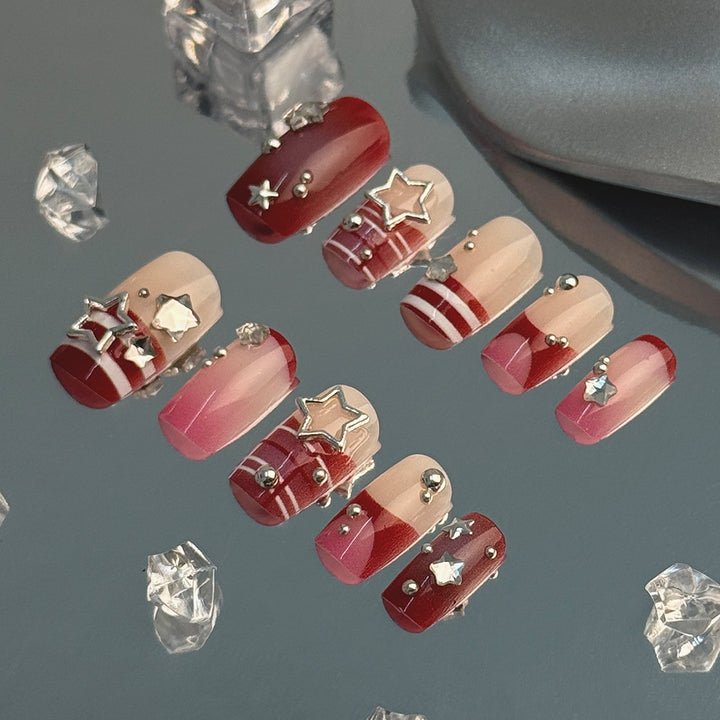 Artificial fingernails with handcrafted star decorations Bowlift