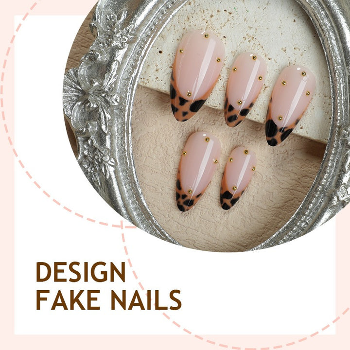 Acrylic nail set with elegant leopard design and gold accents Bowlift