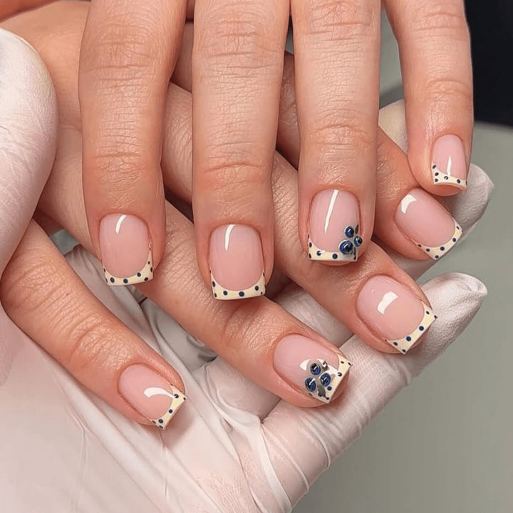 Elegantly designed nail extensions with decorative accents Bowlift