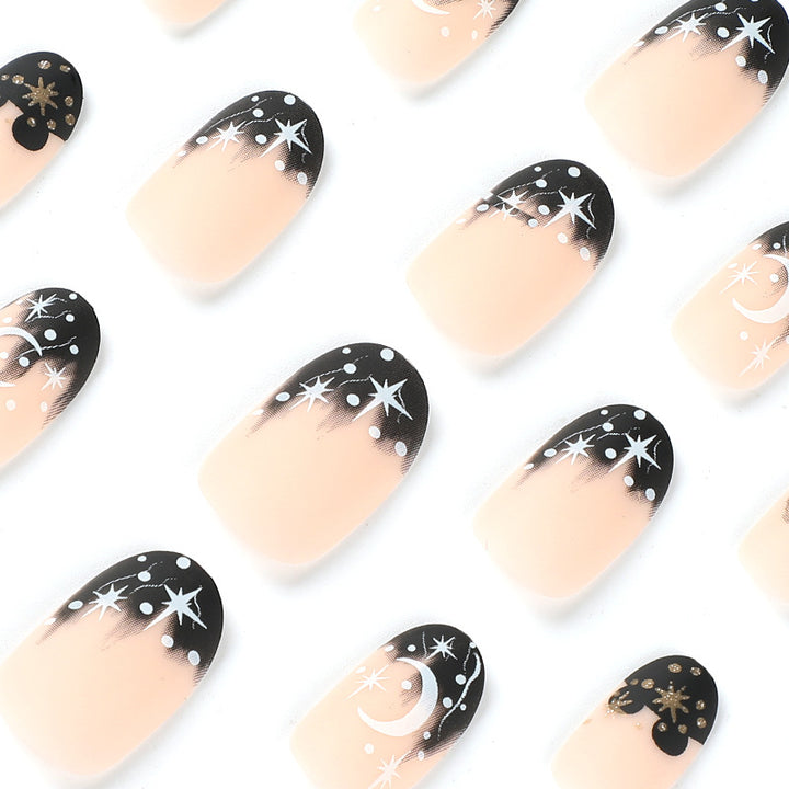 Artistic nail art with moon and star motifs Bowlift