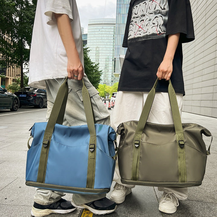 Sporty shoulder bag with water-repellent material and sturdy carrying handles Bowlift