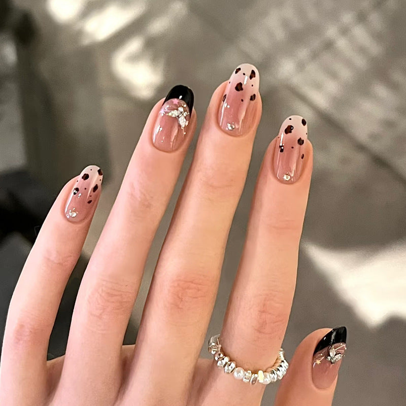 Artistic Press-On Nail Set with Floral and Rhinestone Accents Bowlift