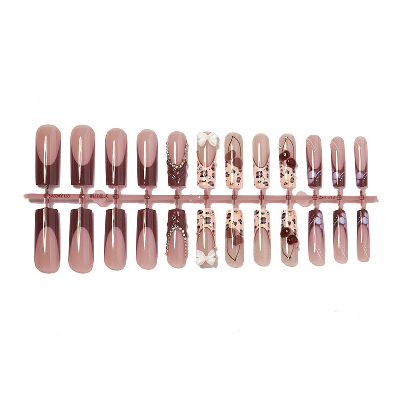 Artistic Press-On Nail Set with Decorative Accents Bowlift