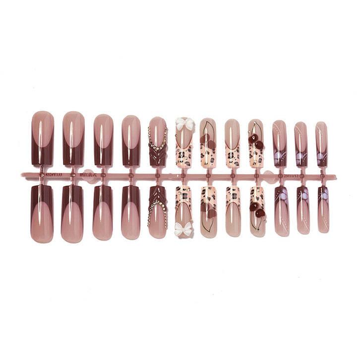 Artistic Press-On Nail Set with Decorative Accents Bowlift