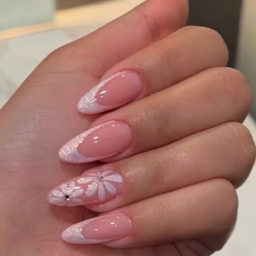 Elegant artificial nails with floral design and glitter embellishments Bowlift
