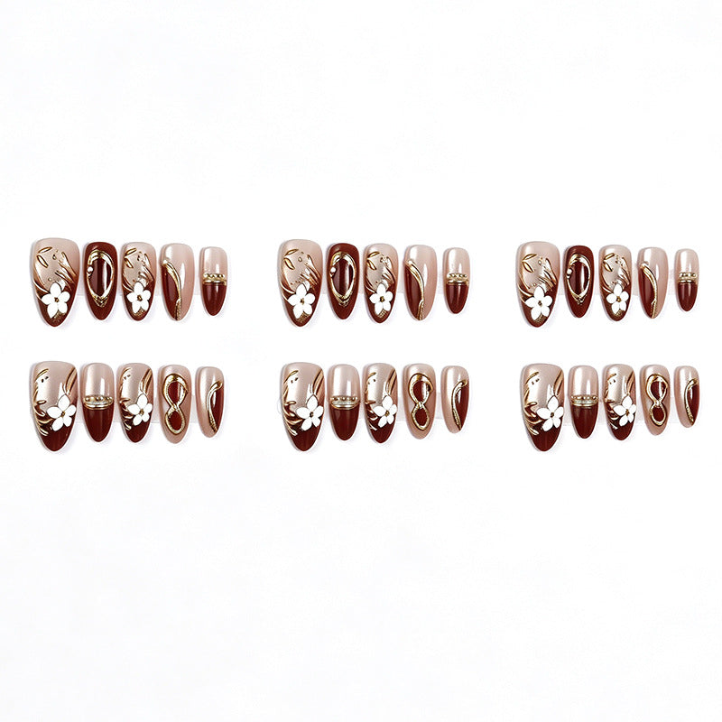 Artistic Press-On Nail Set with Floral and Metallic Accents Bowlift