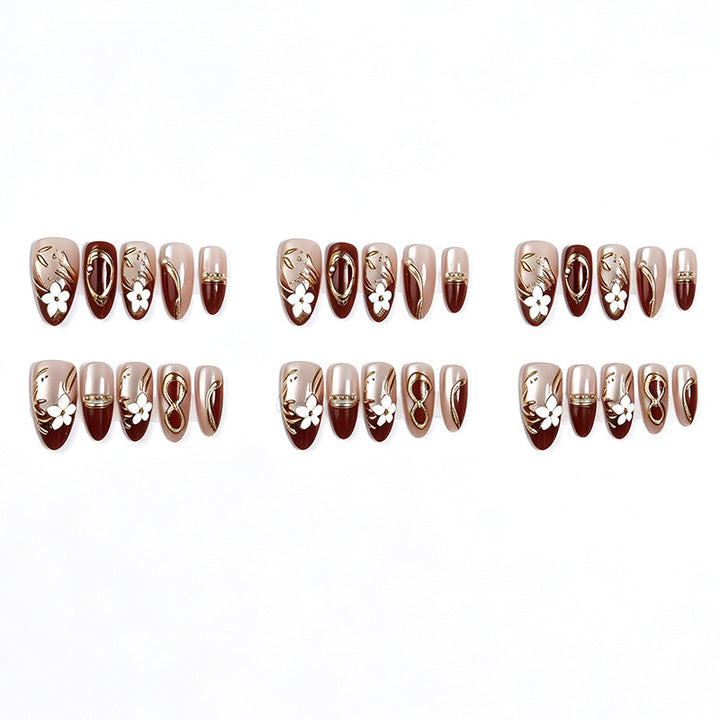 Artistic Press-On Nail Set with Floral and Metallic Accents Bowlift