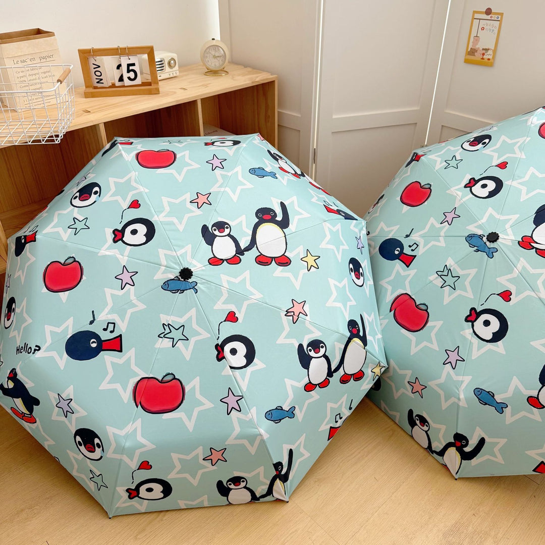 Ladies collapsible umbrella with playful penguin design Bowlift