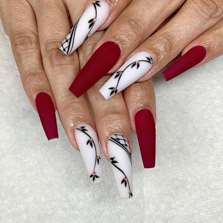 Artistic Long Press-On Nail Set with Floral Accents Bowlift