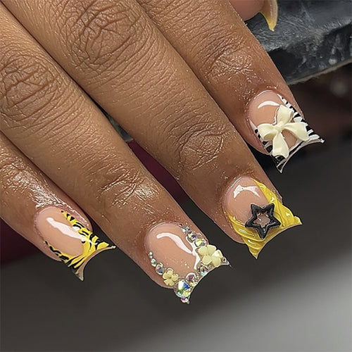 Artistic Nail Art with Glitter and Floral Accents Bowlift
