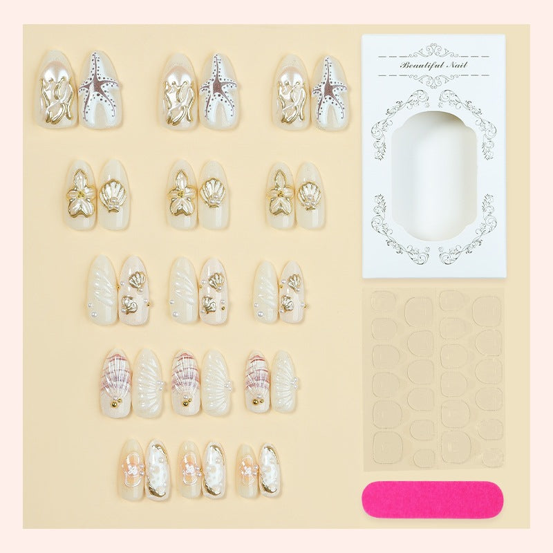luxurious artificial nail set with maritime designs and golden accents Bowlift