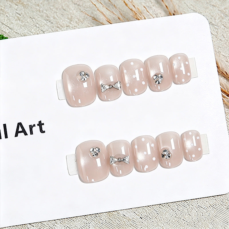 Artificial nail set with elegant glitter and crystal decorations Bowlift