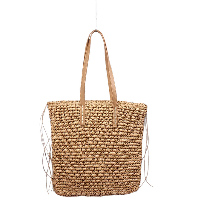 Handwoven beach bag made of natural materials with leather accents Bowlift