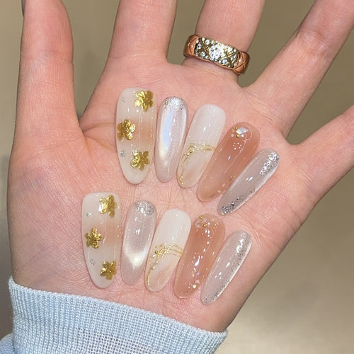 Artificial nails with floral decorations and glitter effects Bowlift